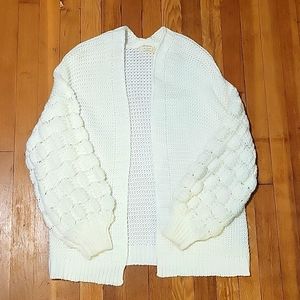 White cardigan knit sleeve detail